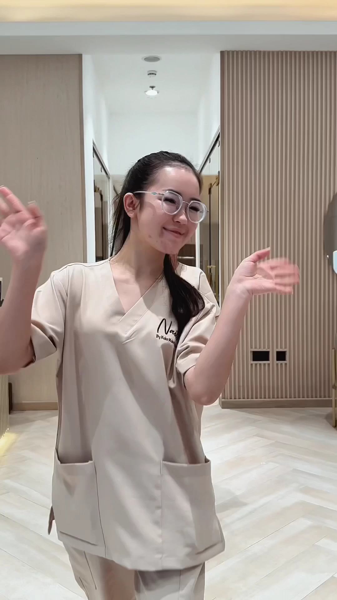 A KOKO MOKO team member welcoming guests in the salon